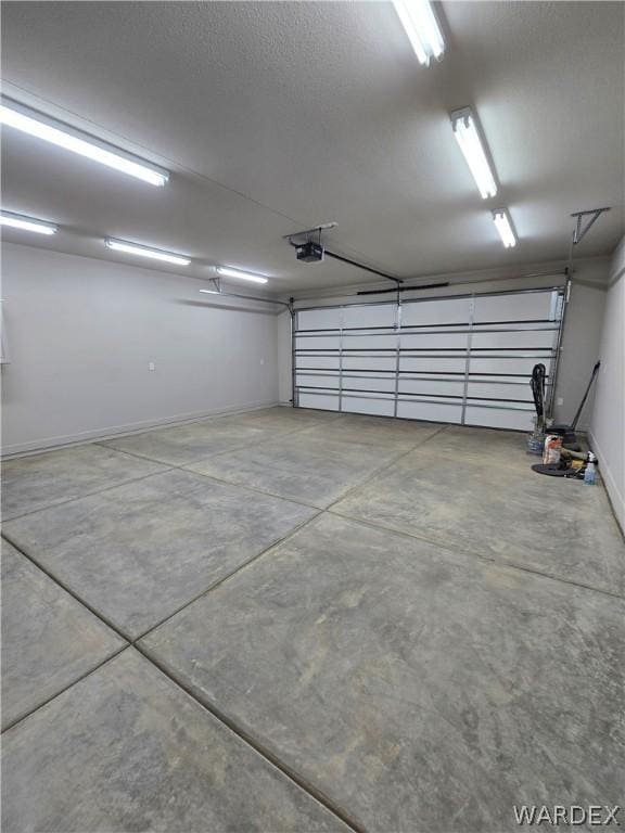 garage featuring baseboards and a garage door opener