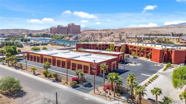 birds eye view of property featuring a mountain view and a city view