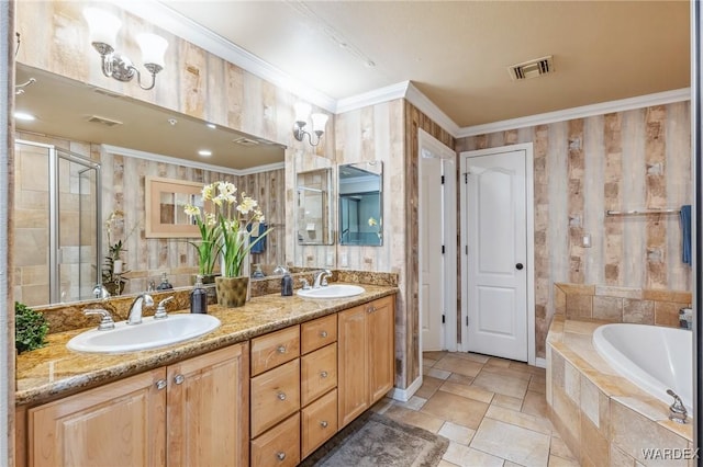 bathroom with double vanity, ornamental molding, a sink, and visible vents