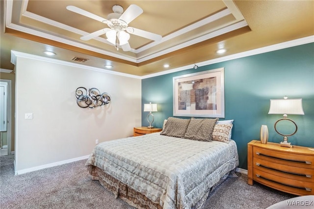 bedroom featuring carpet, baseboards, visible vents, and a raised ceiling