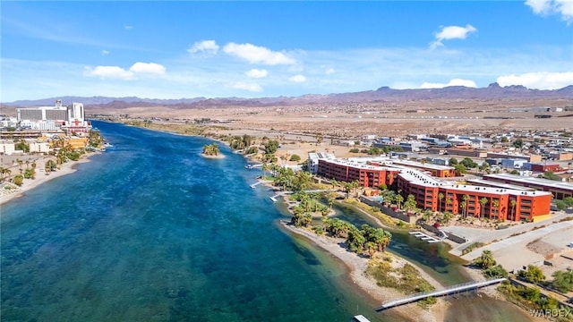 birds eye view of property featuring a beach view and a water and mountain view