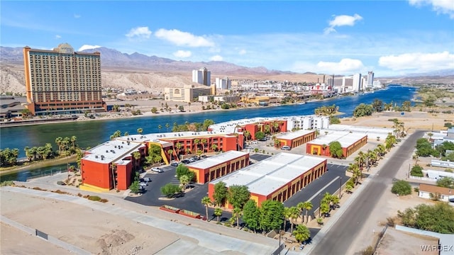 birds eye view of property featuring a view of city and a water and mountain view