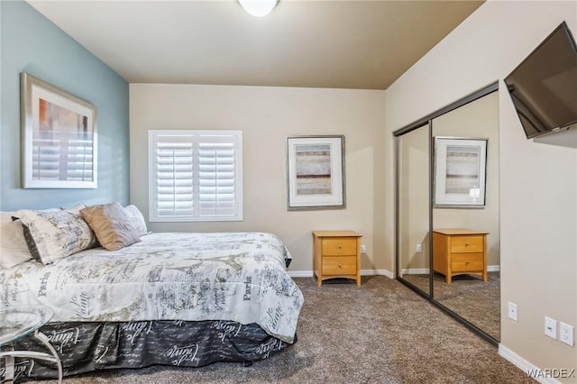 bedroom featuring carpet floors, baseboards, and a closet