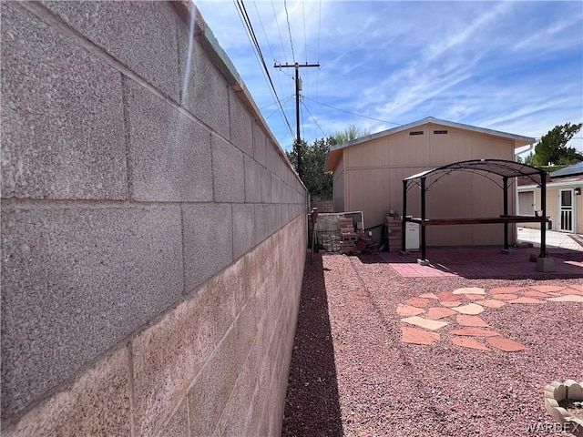 view of side of property featuring fence