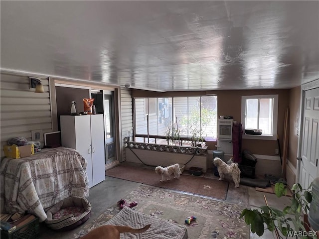 living area featuring concrete flooring