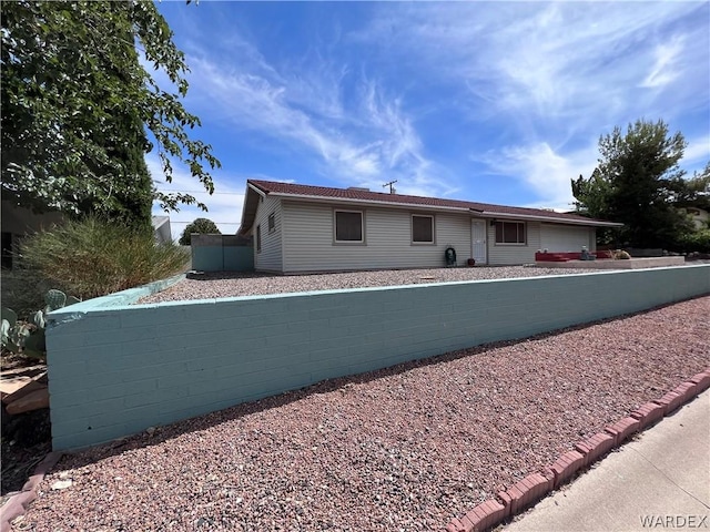 view of front of house with fence