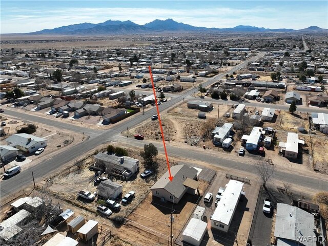 drone / aerial view with a residential view and a mountain view