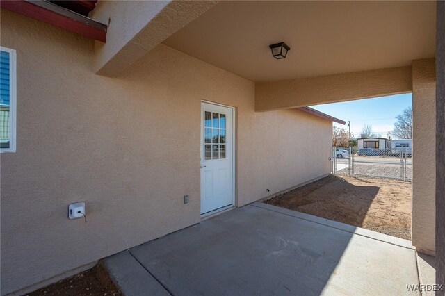 view of patio / terrace with fence and a gate