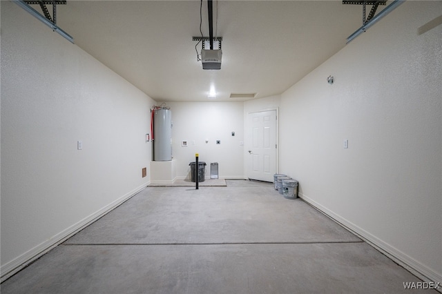 garage featuring a garage door opener, water heater, and baseboards