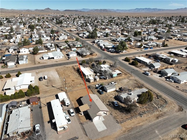 birds eye view of property featuring a residential view and a mountain view