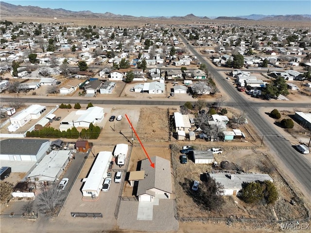 birds eye view of property with a residential view and a mountain view