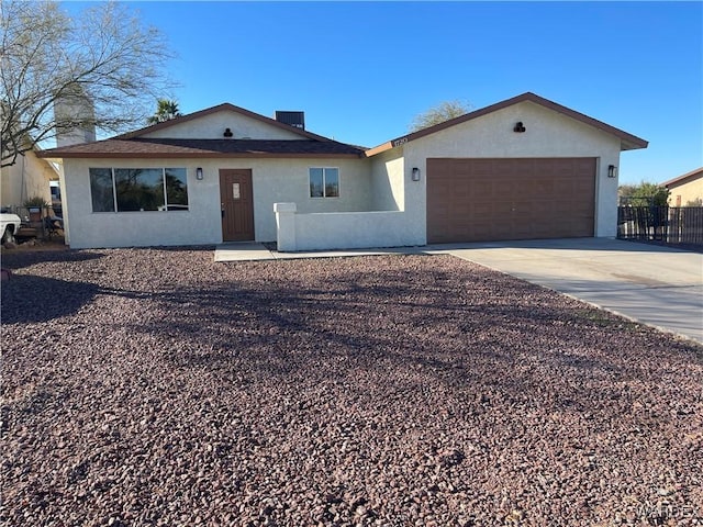 1720 E Valencia Rd, Fort Mohave, AZ 86426 - ranch-style home with an attached garage, stucco siding, driveway, and a chimney