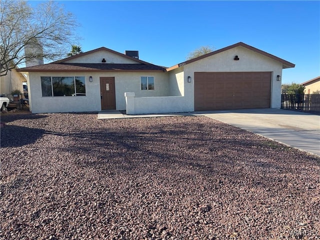 ranch-style home featuring a garage, driveway, fence, and stucco siding