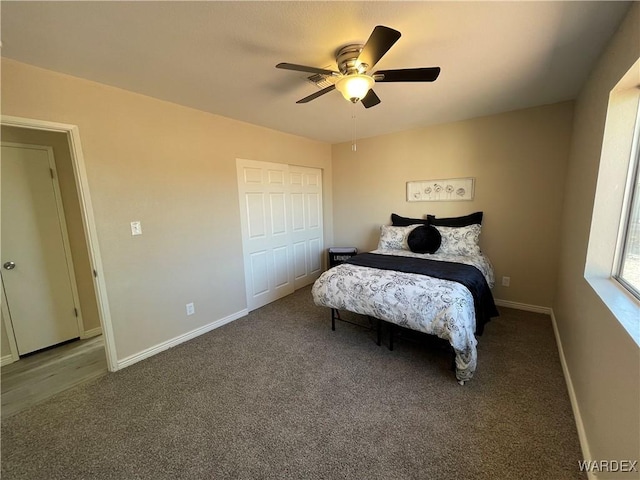 carpeted bedroom with baseboards and a ceiling fan