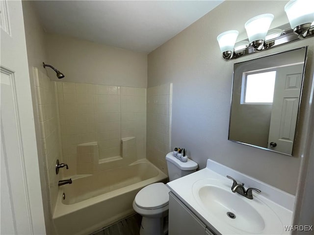 full bath featuring toilet, vanity, and shower / bathing tub combination