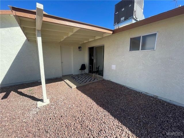 exterior space featuring central AC and stucco siding