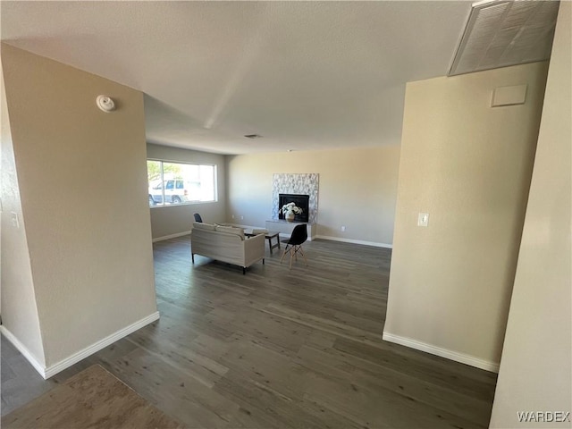 1720 E Valencia Rd, Fort Mohave, AZ 86426 - corridor with baseboards and dark wood-type flooring