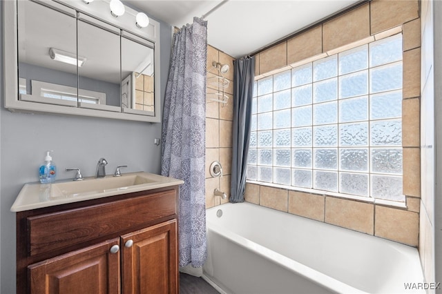 bathroom featuring vanity and shower / bath combo