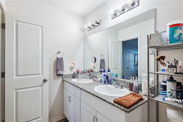 bathroom featuring double vanity and a sink