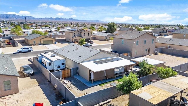 drone / aerial view featuring a mountain view and a residential view