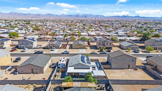 drone / aerial view featuring a residential view and a mountain view