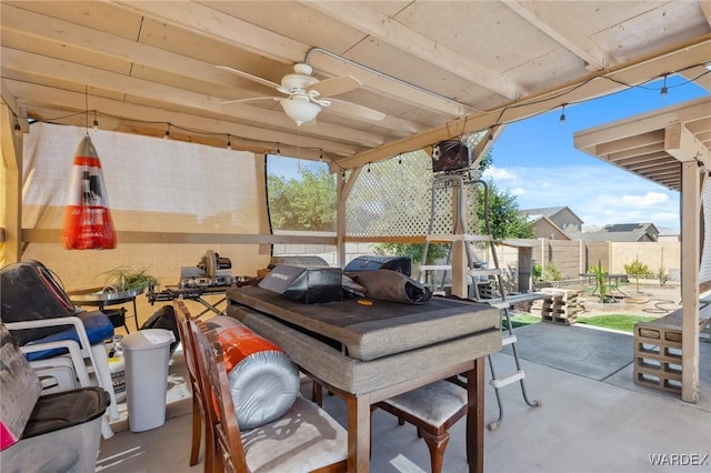 exterior space featuring a ceiling fan, outdoor dining space, and fence