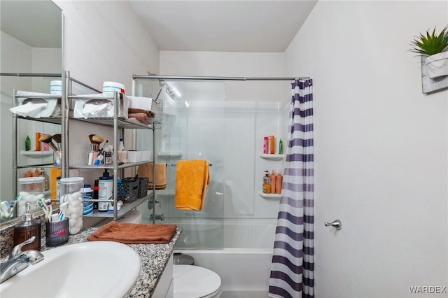 full bathroom featuring shower / tub combo, vanity, and toilet