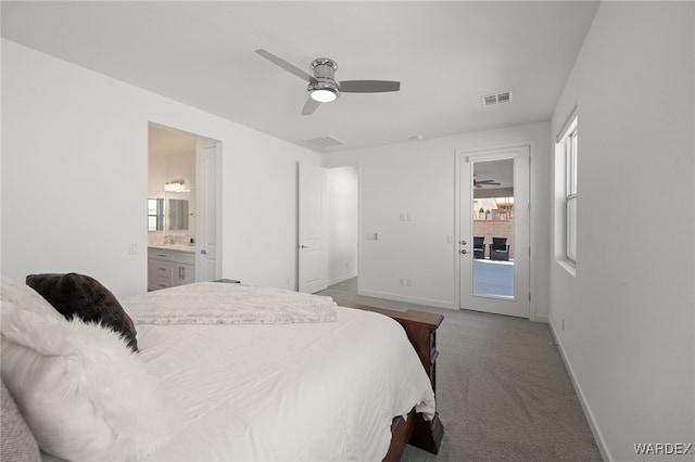 bedroom featuring ensuite bathroom, carpet flooring, visible vents, access to exterior, and baseboards