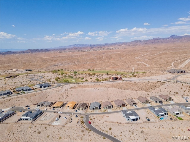 aerial view with a residential view, a desert view, and a mountain view