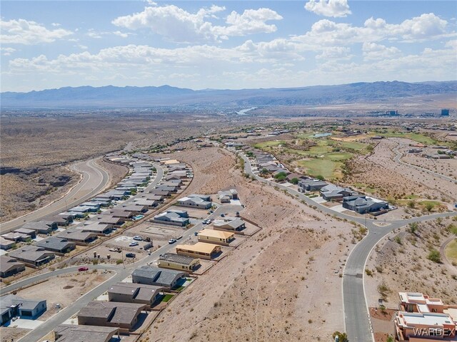 drone / aerial view featuring a residential view and a mountain view