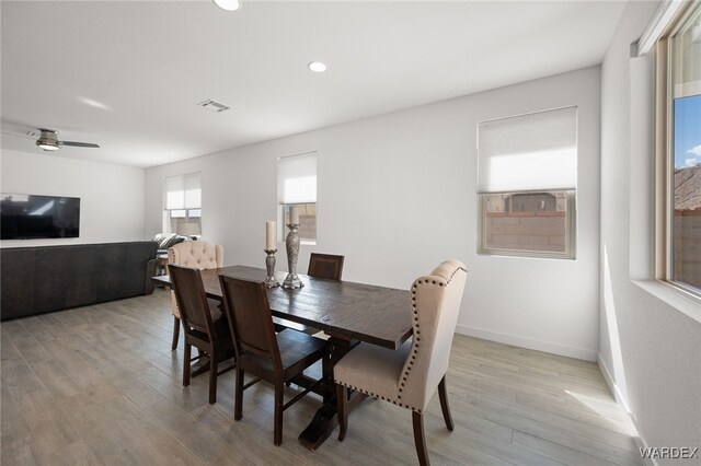 dining room with ceiling fan, light wood-style flooring, recessed lighting, visible vents, and baseboards