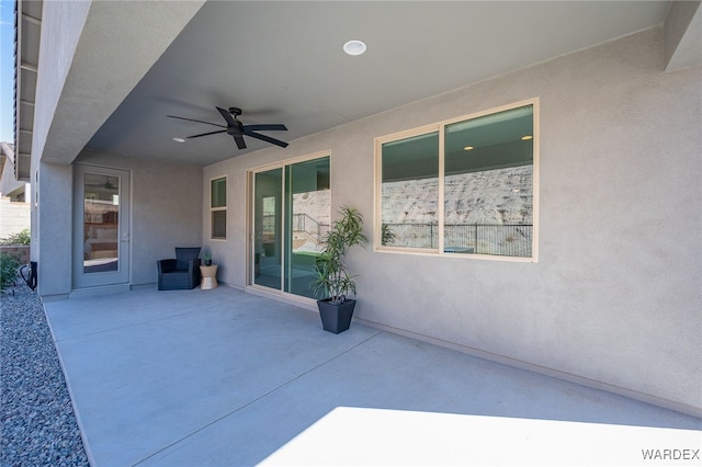 view of patio featuring ceiling fan