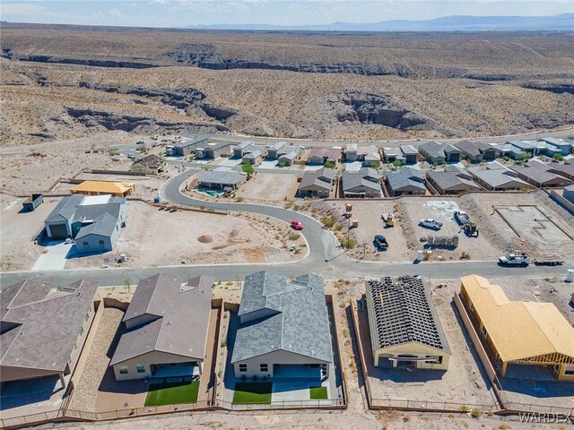 birds eye view of property featuring a residential view and a mountain view