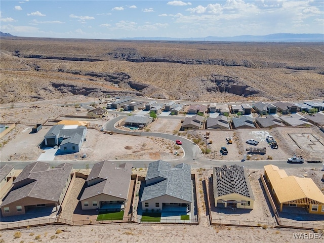 drone / aerial view featuring a residential view and a mountain view