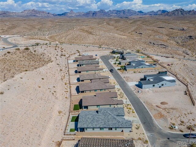 birds eye view of property featuring a mountain view