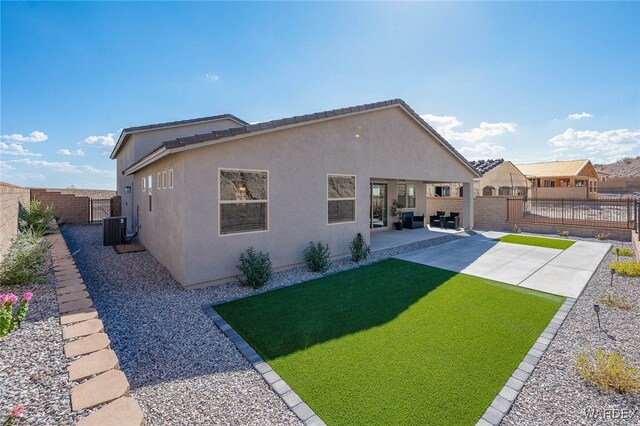 back of property featuring central air condition unit, a patio area, a fenced backyard, and stucco siding