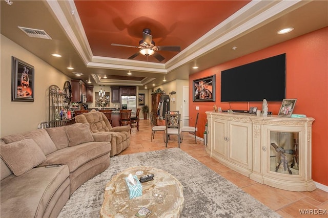 231 Moser Ave Unit G, Bullhead City, AZ 86429 - living area with crown molding, ceiling fan, a raised ceiling, light tile patterned floors, and visible vents