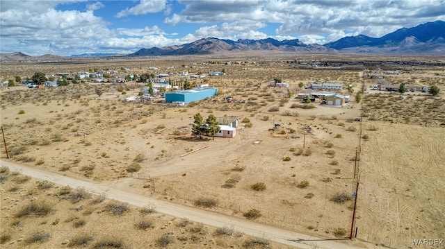 drone / aerial view with a rural view, a desert view, and a mountain view