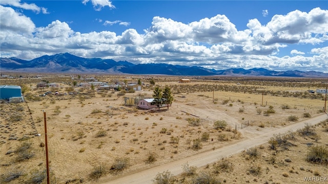 view of mountain feature featuring view of desert and a rural view