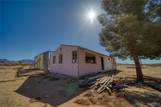 view of side of property featuring an outbuilding