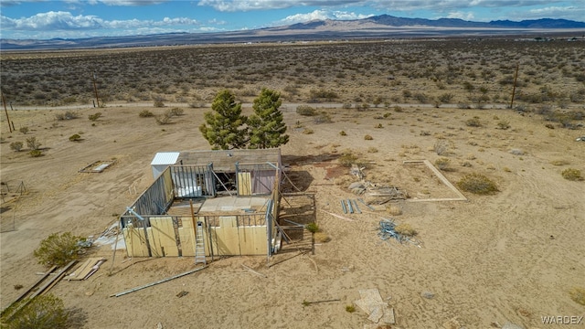 drone / aerial view with a rural view, a desert view, and a mountain view