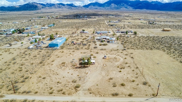 bird's eye view featuring view of desert and a mountain view