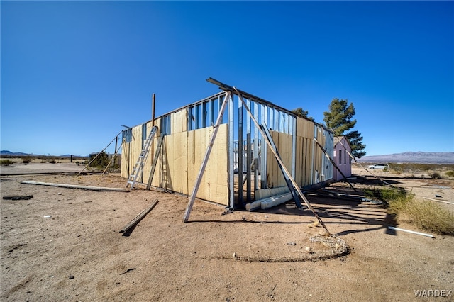 view of outdoor structure featuring a mountain view