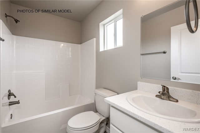 bathroom with toilet, shower / bath combination, and vanity