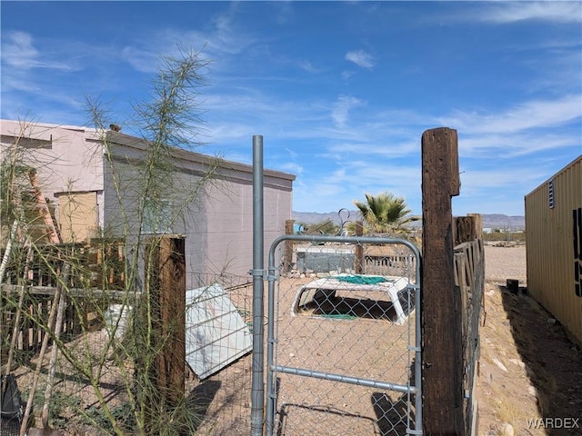 exterior space with fence and a gate