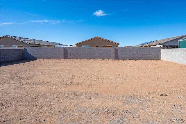 view of yard with a fenced backyard