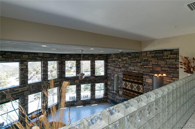 unfurnished living room featuring visible vents