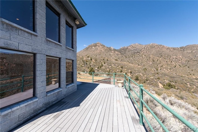 wooden terrace featuring a mountain view