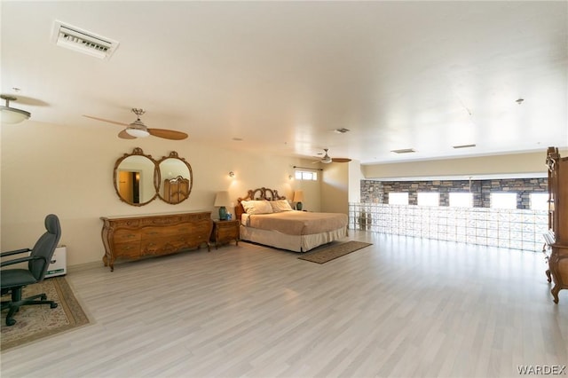 bedroom with ceiling fan, access to outside, visible vents, and light wood-style floors