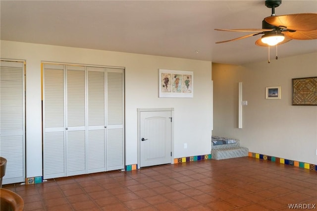 interior space featuring ceiling fan